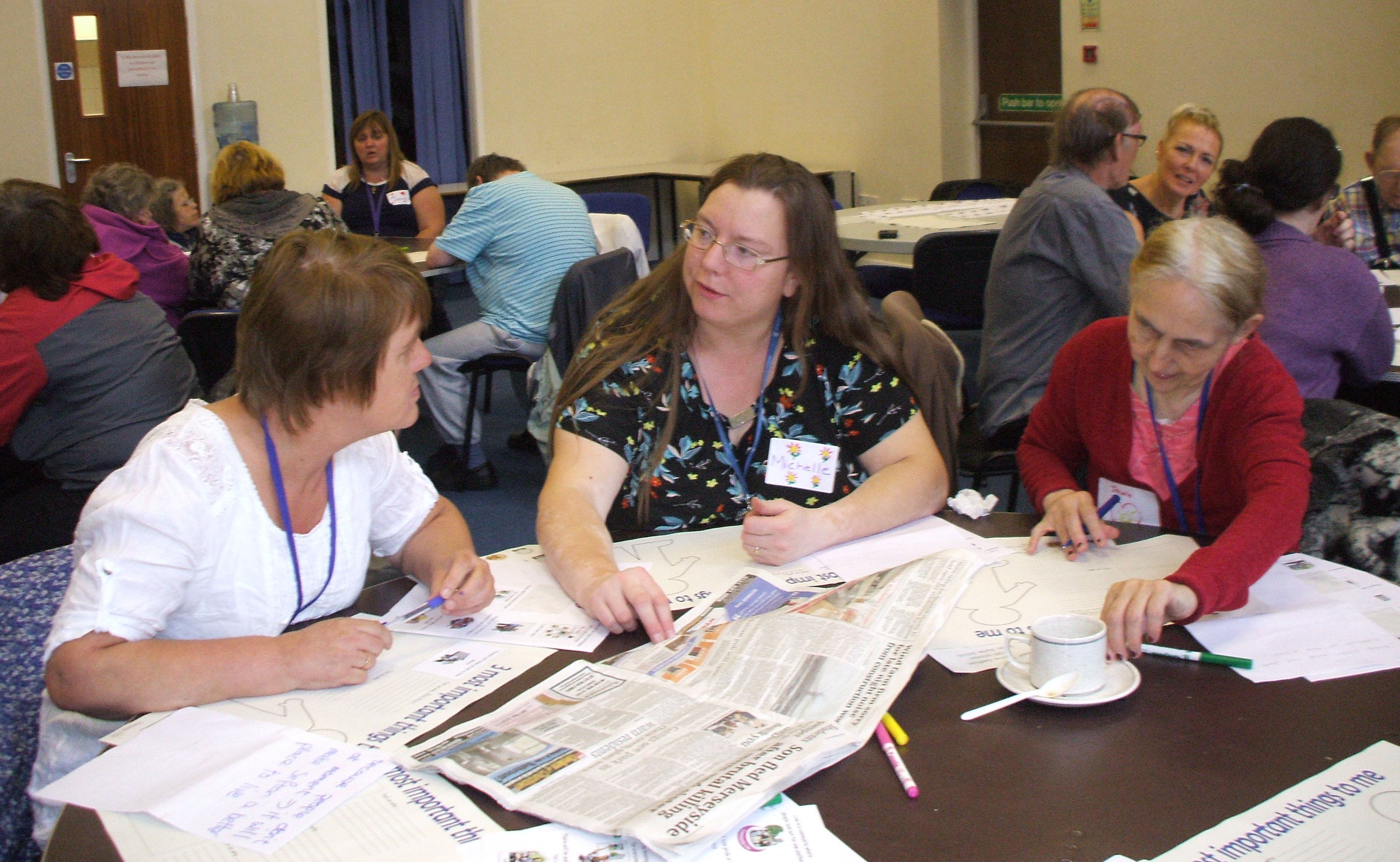 A room of people in an engagement workshop