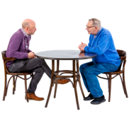 Two men talking at a table