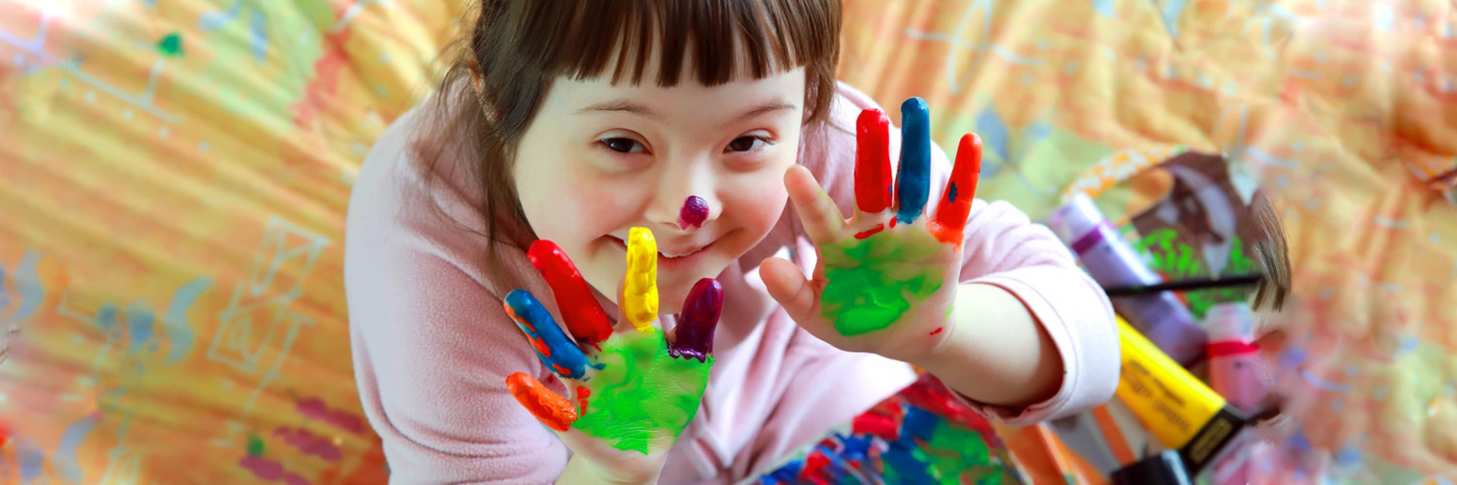 Image of a child with paint on her hands