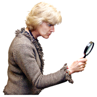 A woman looking through a magnifying glass
