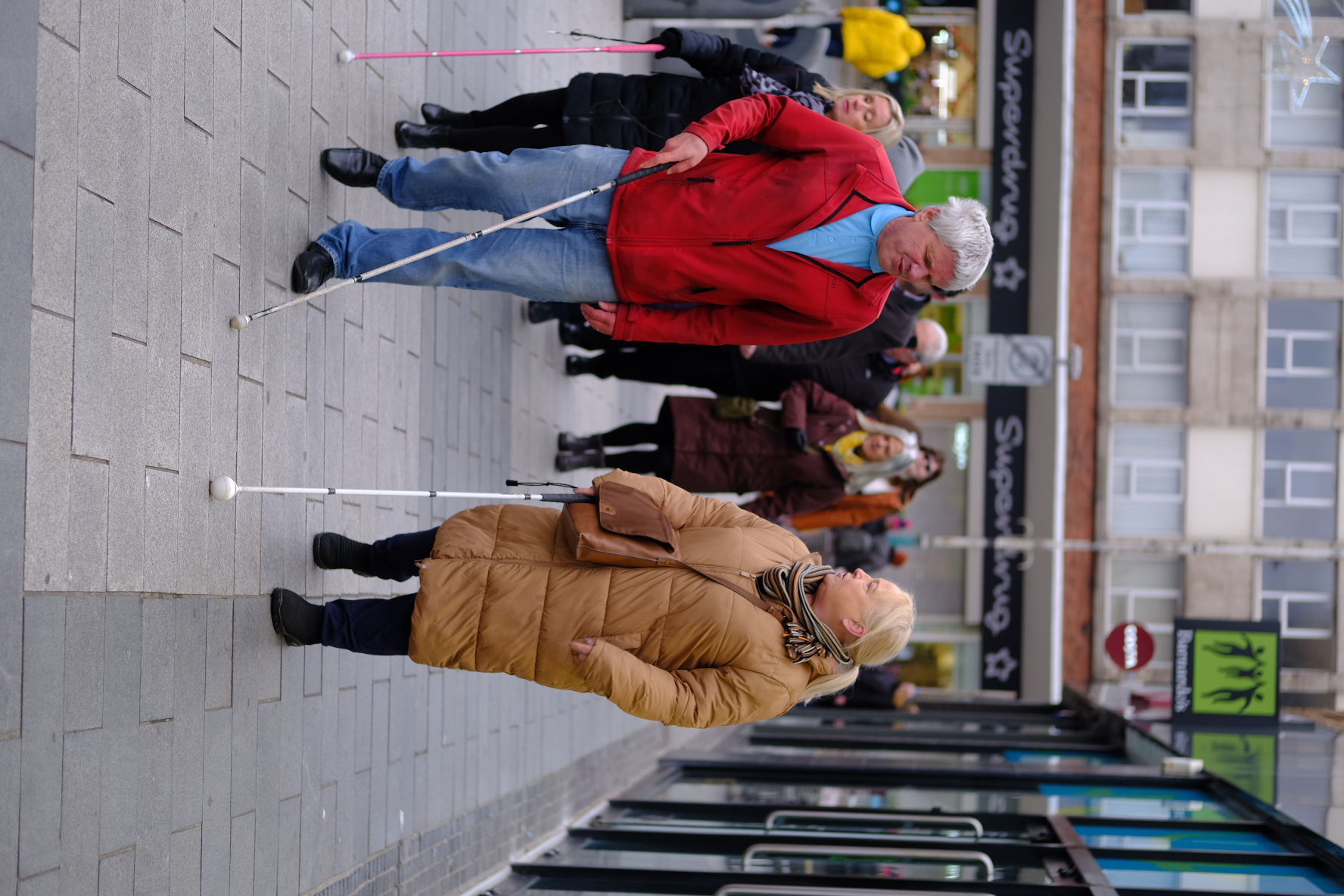 People who are partially sighted or blind leading walks